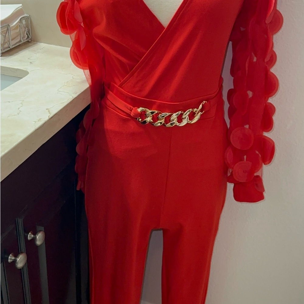 Chic Red Jumpsuit with Gold Chain Accent